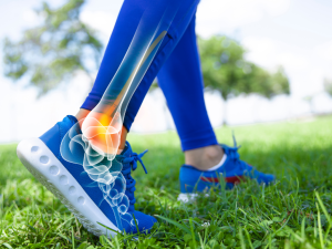 A close-up of an athlete's foot with an illustration of the bone structure, emphasizing sports injury prevention and the importance of injury prevention programs for athletes.