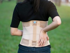 A sit-up machine with integrated back support, designed to provide comfort and stability during exercise. Features a supportive brace for the upper back, helping reduce strain.