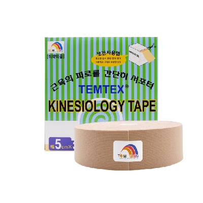 Temtex Kinesiology Tape in beige colour placed in front of its original green-striped retail box, labelled 5cm x 32m