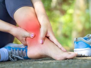 Ankle pain symptoms, including arthritis, tendonitis, and nerve pain, with treatment options for swelling, joint pain, and chronic discomfort