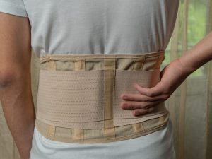 Mueller back support belt designed for people with sciatica, providing comfort and stability for lower back pain relief