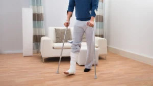 Young person with broken leg preferred to use crutches at home as he cant bend his knee to use a knee walker.