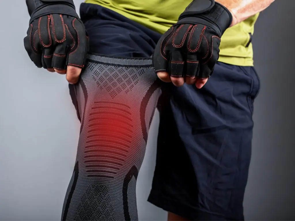 Male wearing a knee support on his right leg to keep his knee stable during movement.