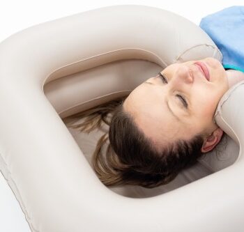 Bedside hair washing basin with water reservoir and shower attachment