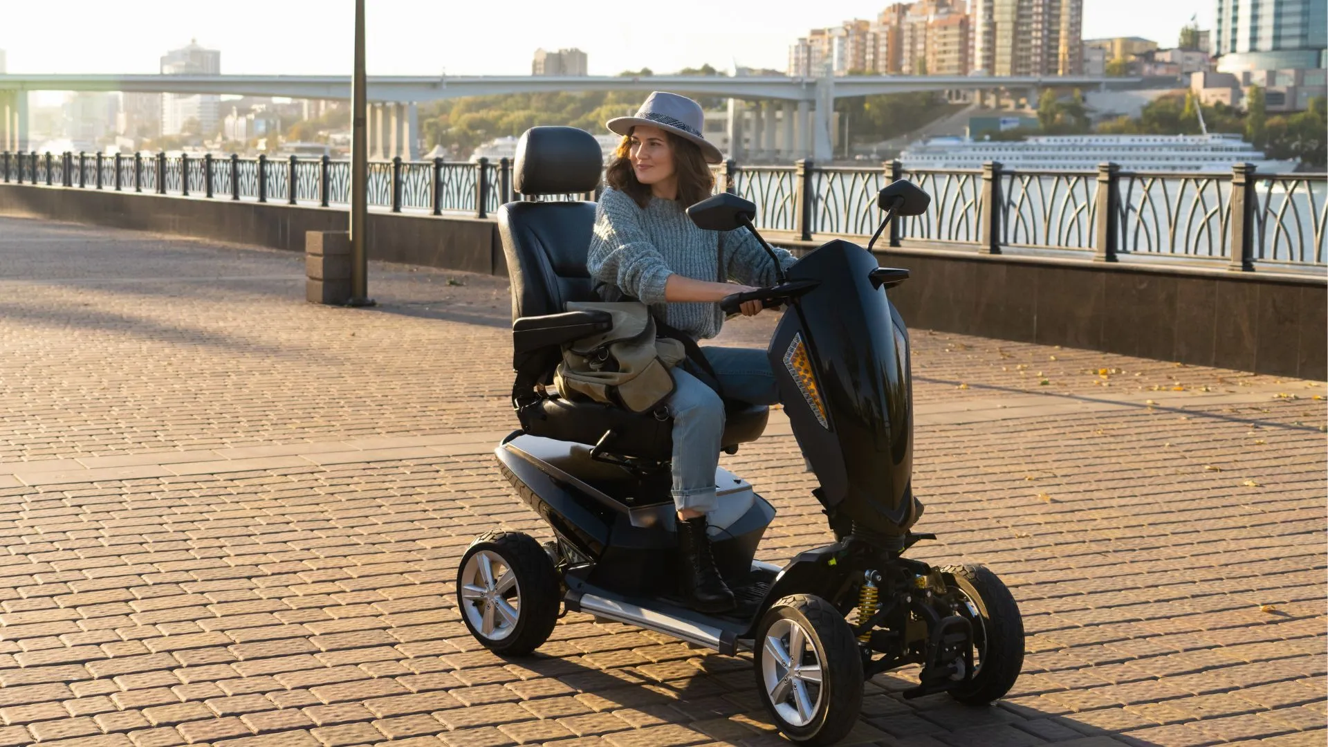 Female using a mobility scooter to help her spend some time outdoors near the river.
