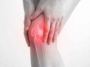 Knee support and knee braces for joint health. The image shows a knee that is in pain and need to be supported by a knee brace.