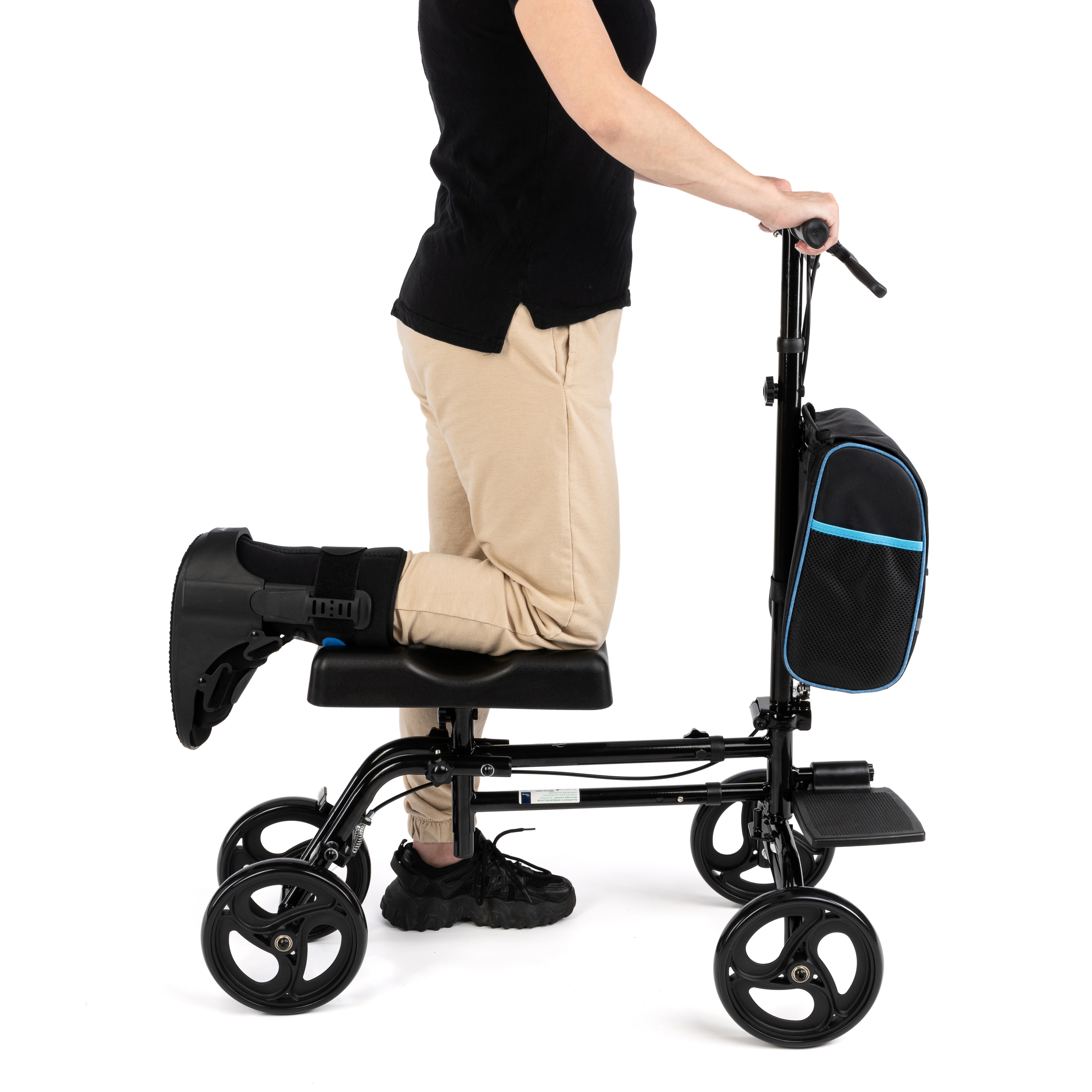 A person using the Deluxe Knee Walker, demonstrating its comfortable knee support and easy steering for leg or ankle injury recovery