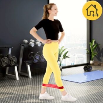 Woman doing side leg raise with resistance band targeting lower body muscles