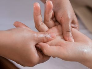 Various massage creams including cocoa butter, amber, and anti-cellulite formulas for skin care. Focus on creams for stretch marks, facial treatments, and cellulite reduction.