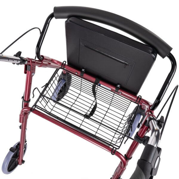 Close-up of removable open basket positioned under padded seat of the rollator.