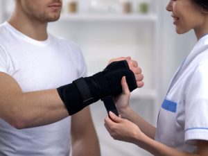 Image of a wrist brace designed for sprain and tendonitis support, showcasing its adjustable features for comfort. Also includes a shoulder support brace for torn rotator cuff