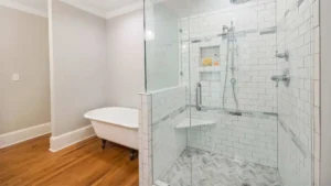 Bathroom setting and a wall-mounted shower chair for elderly use.