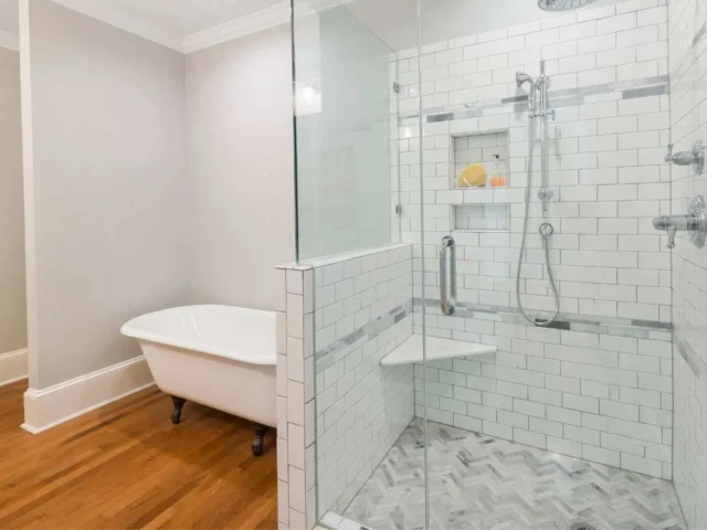 Bathroom setting and a wall-mounted shower chair for elderly use.