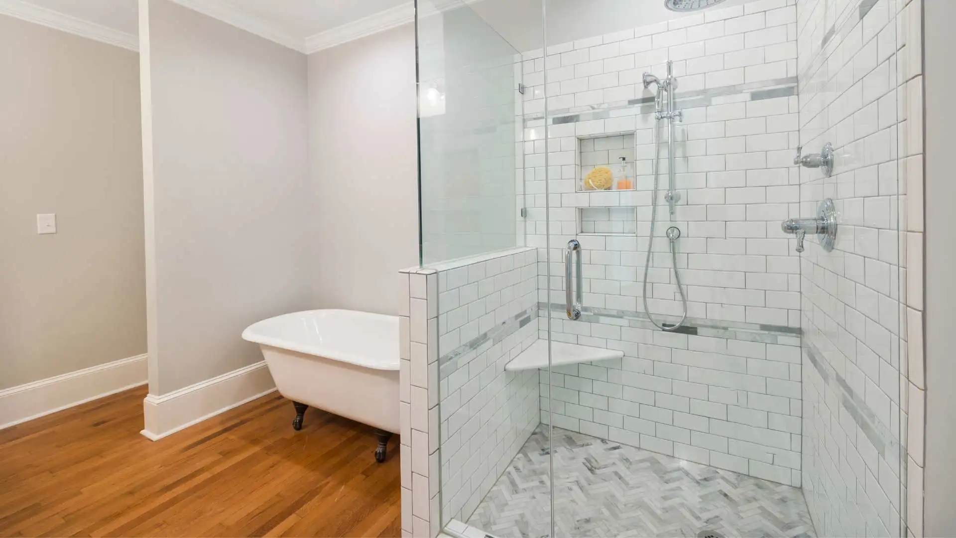 Bathroom setting and a wall-mounted shower chair for elderly use.