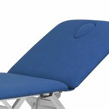 Close-up of Chagall Neo 2 treatment table headrest with face hole and blue padding