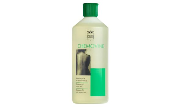 A 500ml bottle of Chemovine professional massage oil with clear labelling and pump dispenser