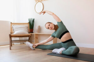 A soccer player performing dynamic flexibility training exercises to improve performance, part of a flexibility training program to enhance mobility and strength.