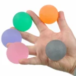 Multiple gel massage balls shown between fingers, displaying size, colour options.
