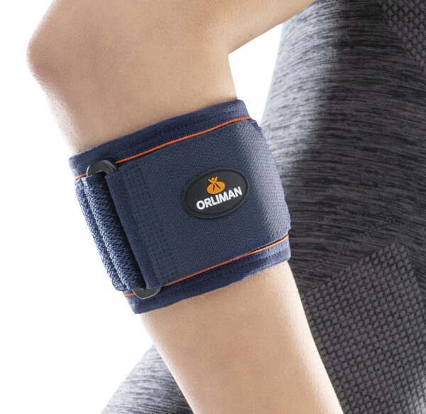 Person wearing a neoprene epicondylitis brace on forearm for tennis or golfer’s elbow support