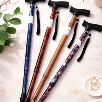 djustable walking cane with wood-effect shaft, black ergonomic handle, wrist strap, and non-slip rubber ferrule
